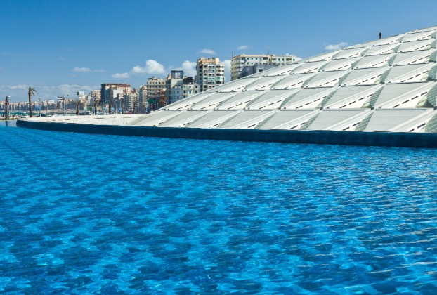 View of blue water and modern architectural structure.