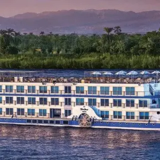 Cruise ship sailing on a tranquil river